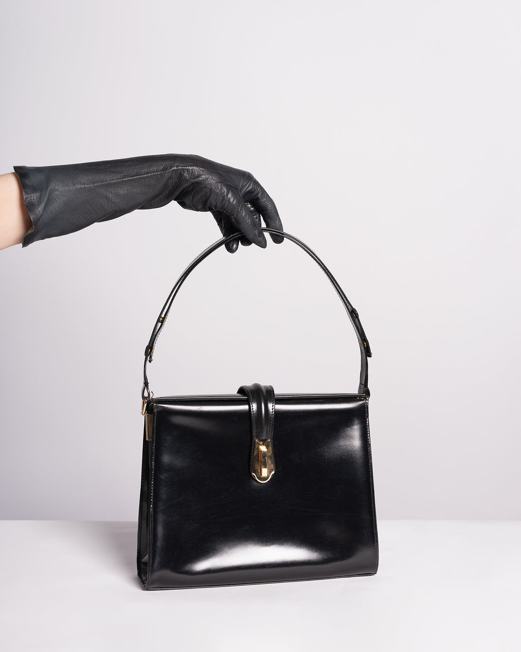 1960s Black leather Structured purse with adjustable strap