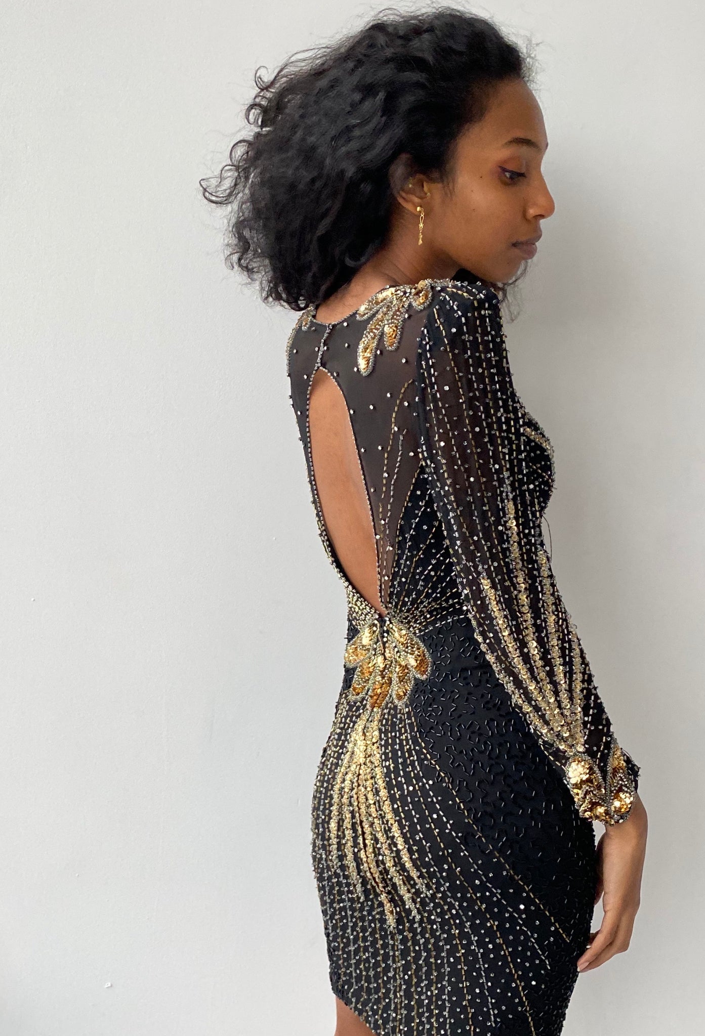 Black & gold sequinned long sleeve mini dress nouveaurichevintage Black & gold sequinned long sleeve mini dress nouveaurichevintage