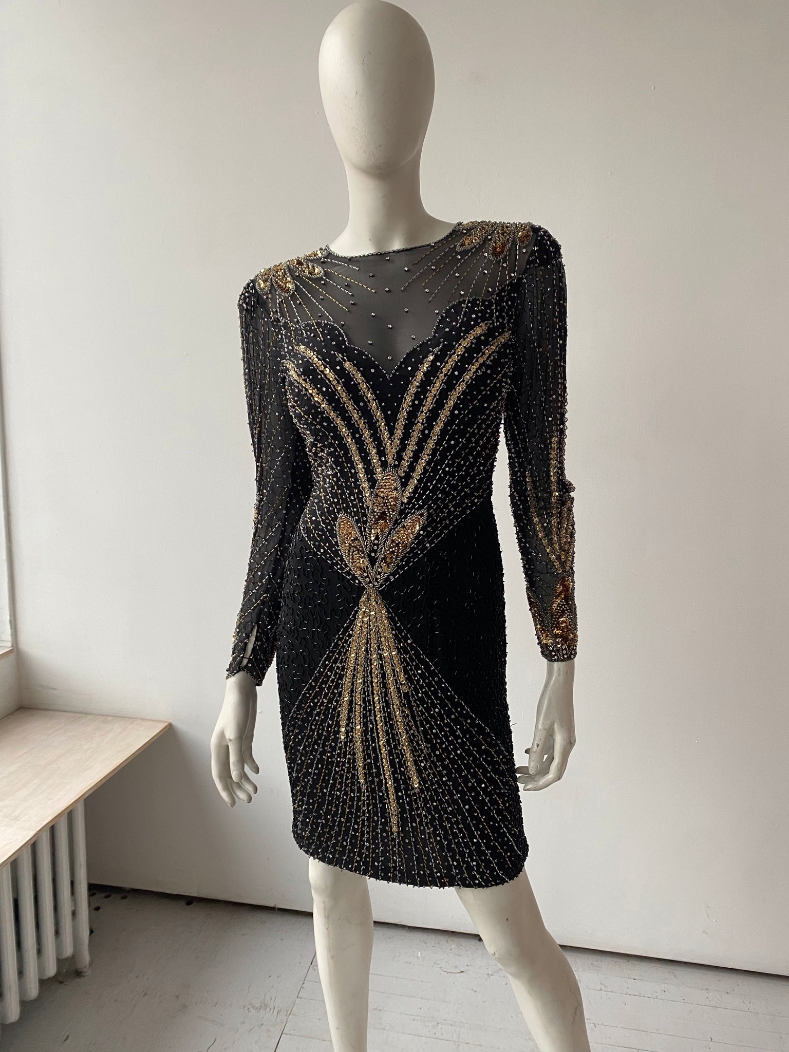 Black & gold sequinned long sleeve mini dress nouveaurichevintage Black & gold sequinned long sleeve mini dress nouveaurichevintage